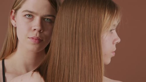 Two Young Adults Posing in Studio