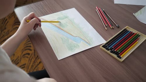 Artist Drawing Colorful Nature Scene with Pencils