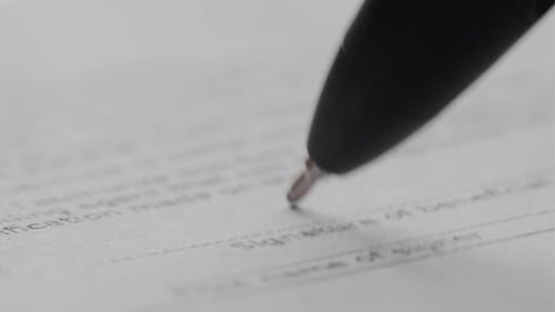 Signature on Contract By Pen in Hand