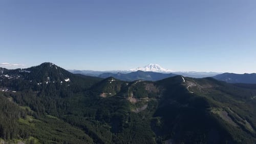 Washington Cascade Mountains Aerial With Mt Rainier And Spring Blue Sky