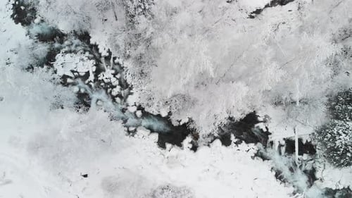 River in the Winter Snow Forest in the Mountains