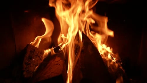 Crackling Fireplace with Bright Flames in the Dark