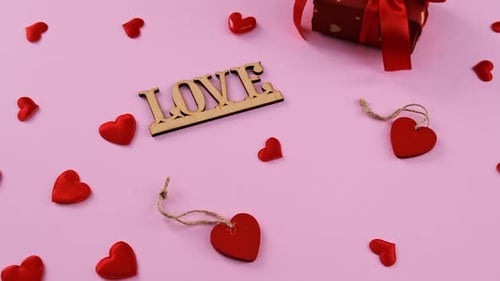 Red Hearts and Gift Symbolizing Love and Affection