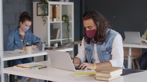 Businesspeople in Face Masks Working in Office