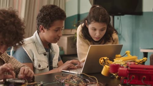 Kids Working on Robot Project with a Laptop