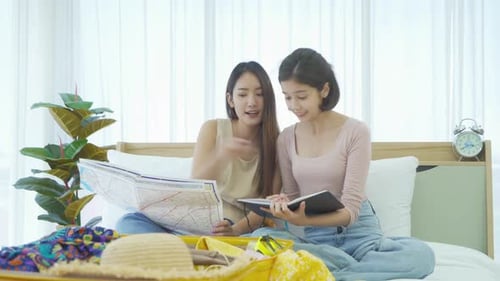 Two Young Women Plan a Fun Trip Together