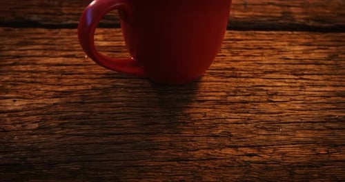 Red Mug with Coffee and Cream on Wood