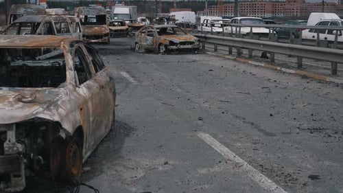 Burnt Cars on Highway Aftermath of Conflict