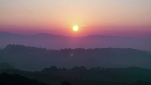 Spectacular Sunrise Over Silhouetted Mountain Landscape