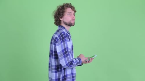 Young Adult Using Phone on Chroma Key Green Screen