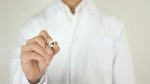 Man Writing Medical Care on Clear Surface
