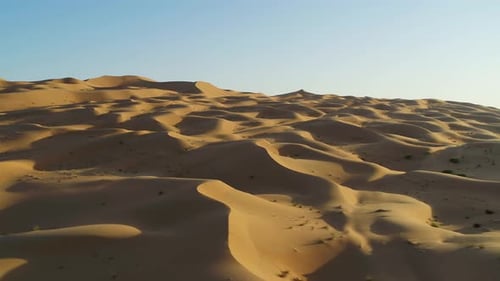 Aerial view of Dubai desert at sunset, United Arab Emirates.