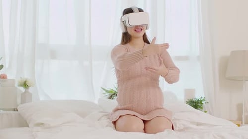 Pregnant Woman Enjoys VR Experience at Home