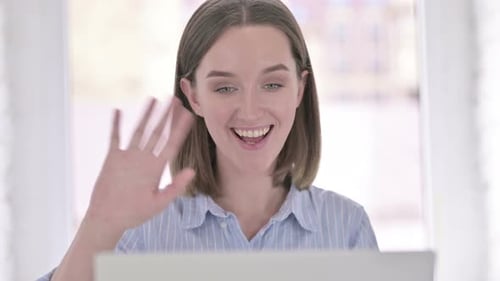 Happy Young Adult Woman Video Calling with Laptop