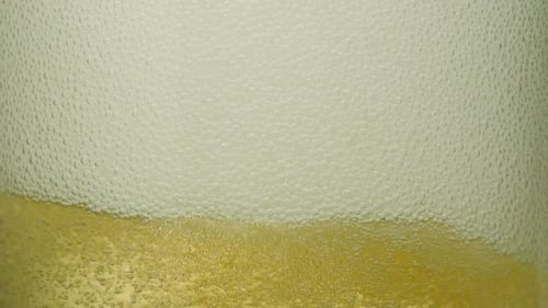 Extreme close-up ginger ale bubbles in a glass, Slow Motion