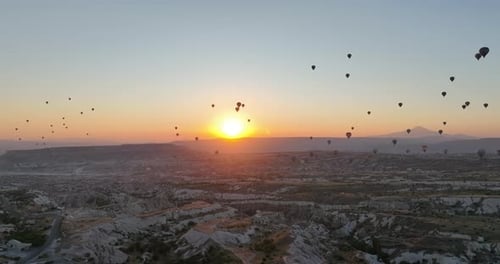 Aerial Cinematic Drone View of Colorful Hot Air Balloon Flying Over Cappadocia