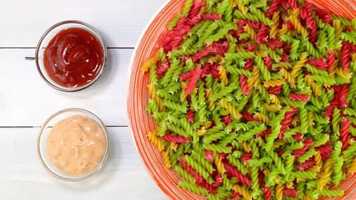 Colorful Spiral Pasta with Sauces, Overhead Shot