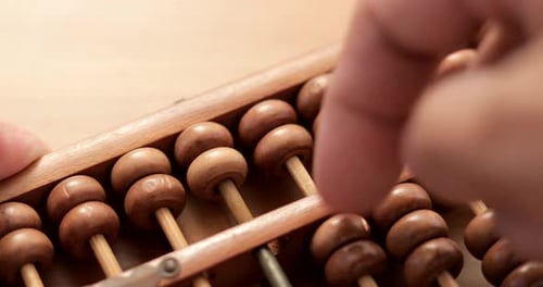 Operating Traditional Wooden Abacus for Calculation
