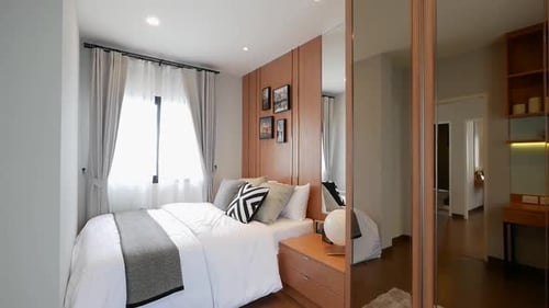 Modern Bedroom Interior With Mirrored Closet