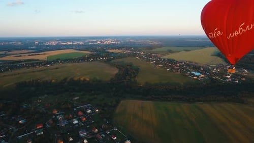 Hot Air Balloon in the Sky Over a Field
