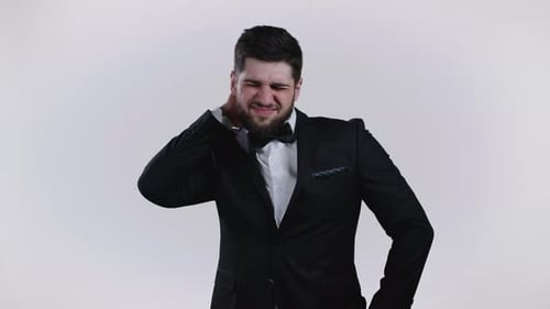 Man in Suit Experiencing Neck and Shoulder Pain