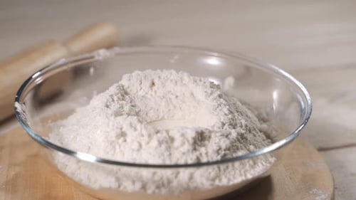 Egg Falls on a Pile of Flour. Shot with High Speed Camera.