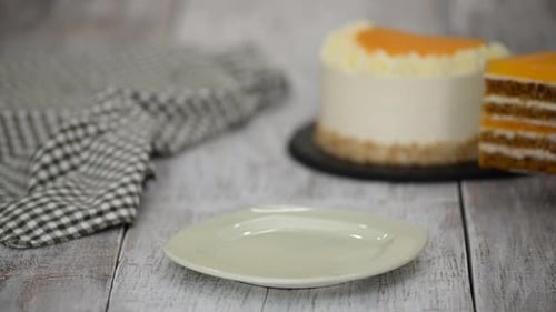 Slice of Carrot Cake Being Placed on Plate