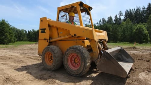 Construction Worker Operating Machinery in Rural Environment