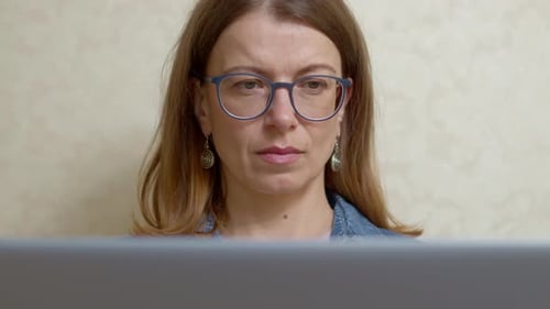 Woman With Glasses Looking at Computer Screen