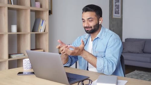 Bearded Man On Laptop During Video Conference