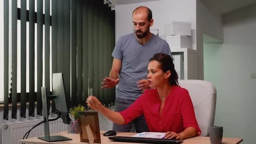 Businesswoman Working with Colleague in Modern Office