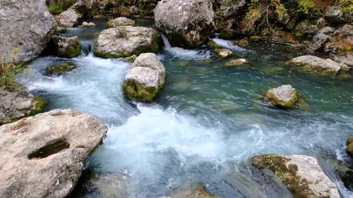 Rapid Stream Flowing Through Rocky Terrain