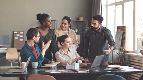 Multiracial Creative Team Coworking in Office
