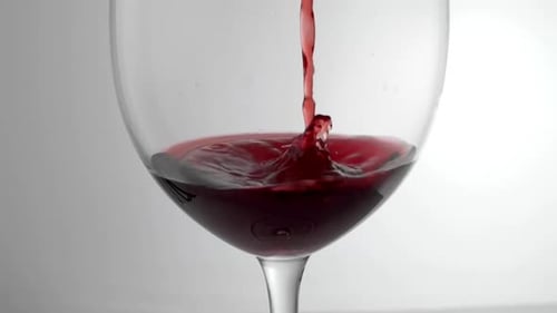 Pouring Red Wine into a Glass Close Up
