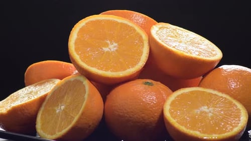 Fresh Oranges Cut and Whole Gyrating