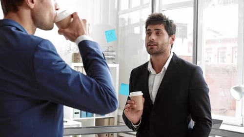 Businessmen Discussing Ideas in Modern Office Setting