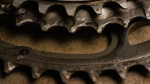 Macro Shot of Interlocking Gears on Brown Surface