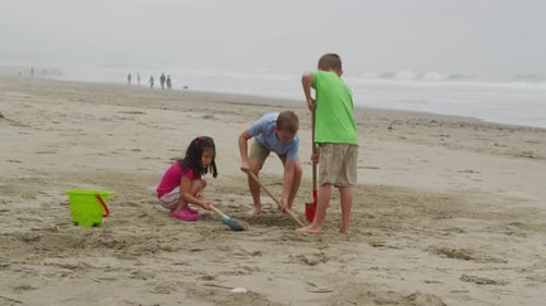 Children playing at beach. Shot on RED EPIC for high quality 4K, UHD, Ultra HD resolution.