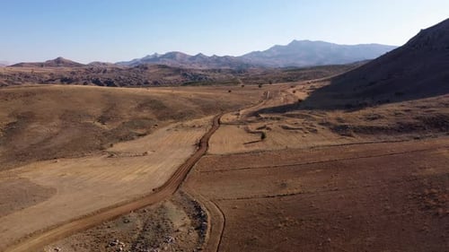 Aerial View of a Valley of a Rocky Mountains on a Summer Day
