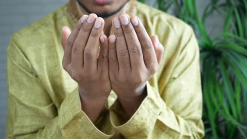 Muslim Man Keep Hand in Praying Gestures During Ramadan Close Up