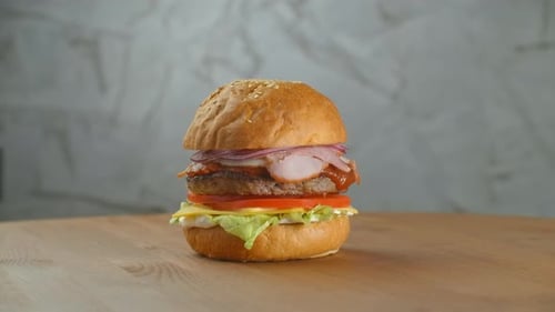 Juicy Burger with Bacon and Fresh Vegetables