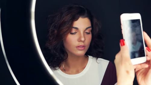 Woman Posing with Ring Light for Smartphone Photo