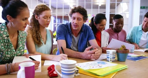 Creative Business Team Brainstorming Together at Office