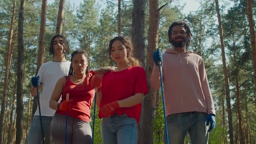 Group of People Posing Together in Forest