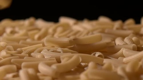 Falling Down Italian Pasta, on Black, Rotation, Close Up, Slow Motion
