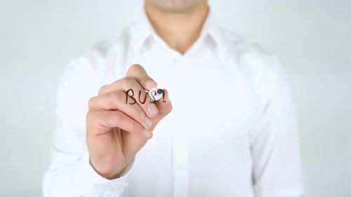 Man Writes Business Presentation on Clear Surface