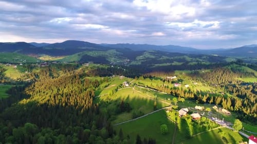 Mountain Village Under Cloudy Sky