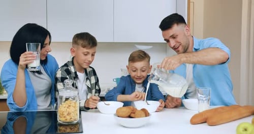 Happy Family Enjoying Breakfast Together in Bright Kitchen