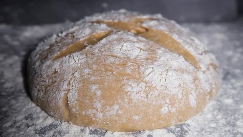 Close Up of a Floured Loaf of Bread