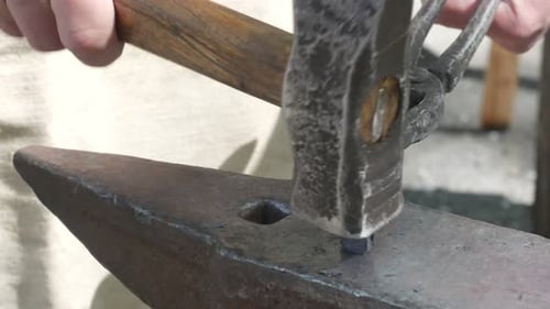 Smith Works with Hammer